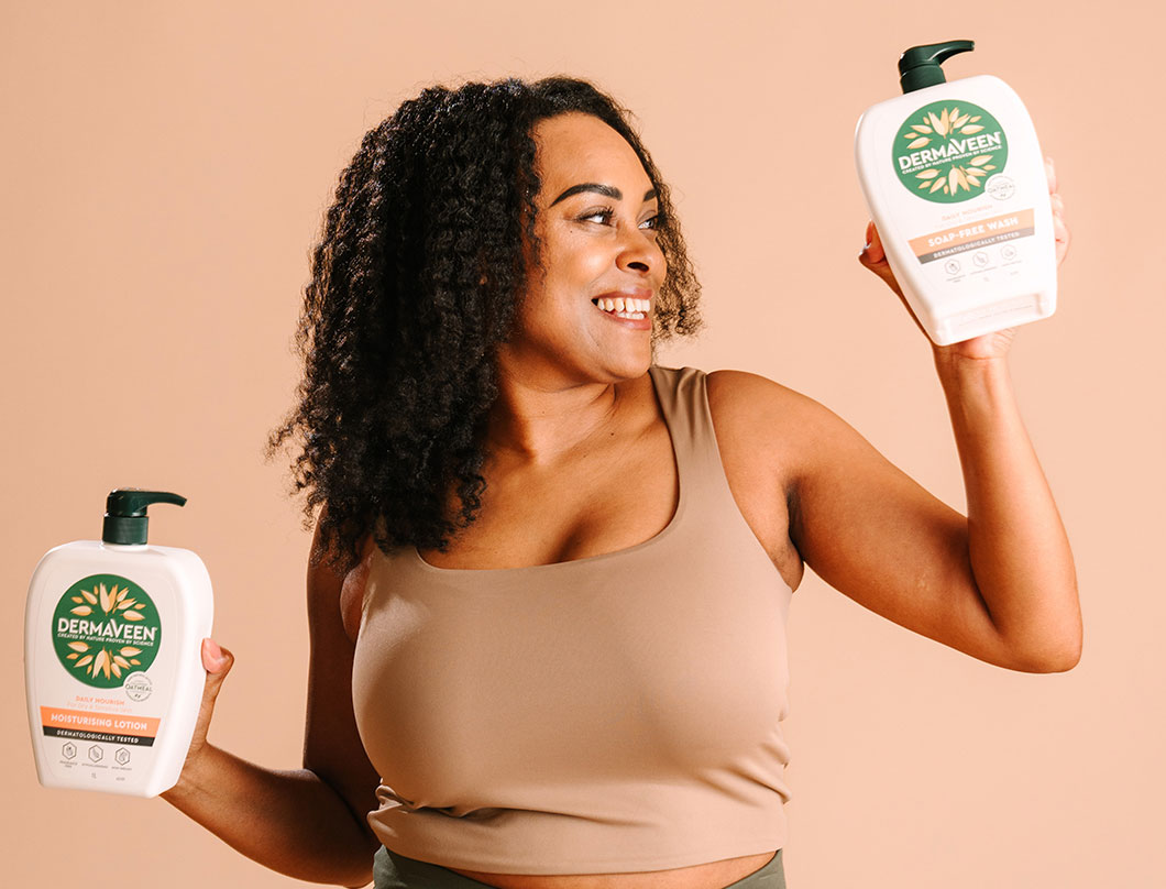 Lady holding Dermaveen products with colloidal oatmeal ingredients